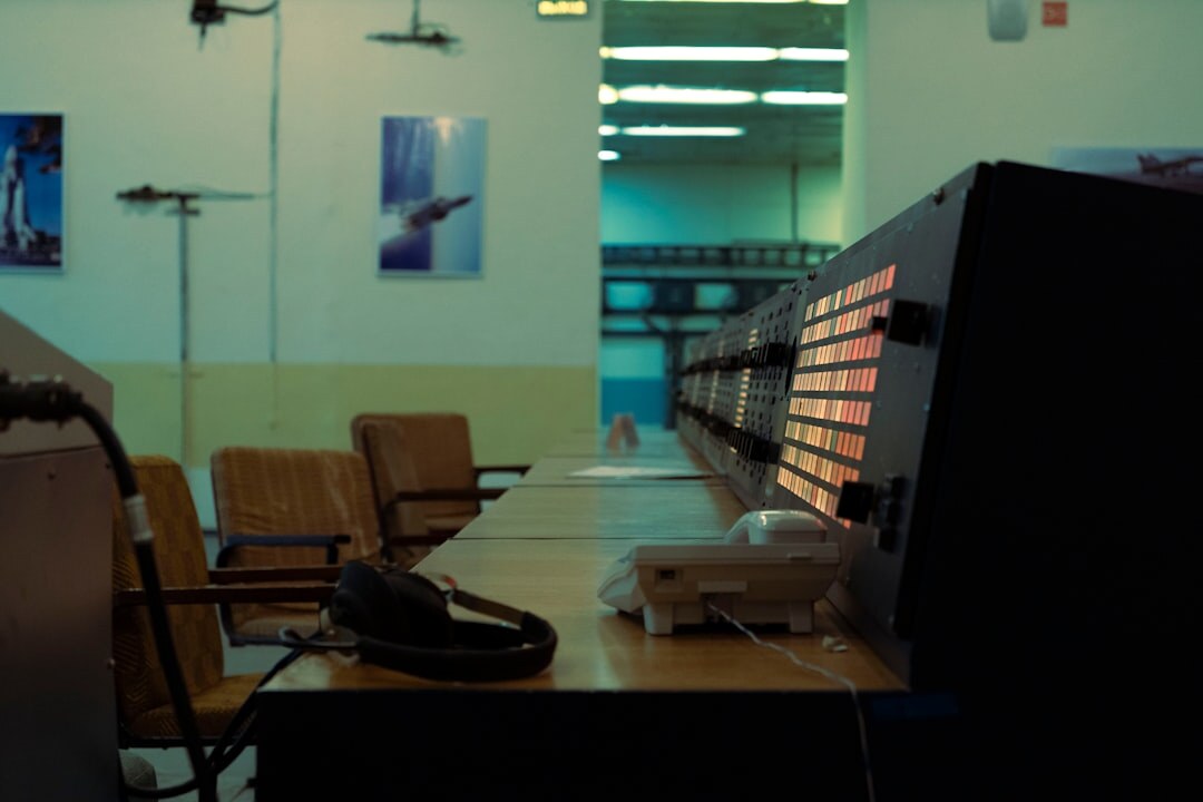 TV director watching monitors in control room