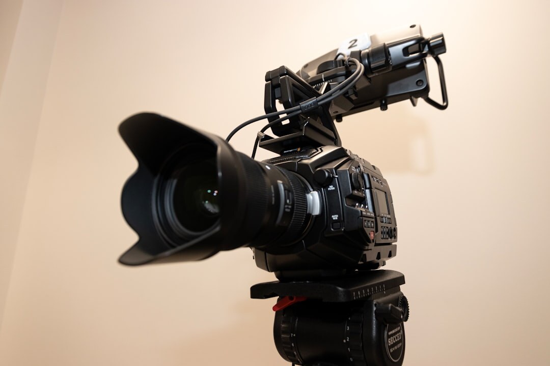 Professional video camera on tripod in TV studio